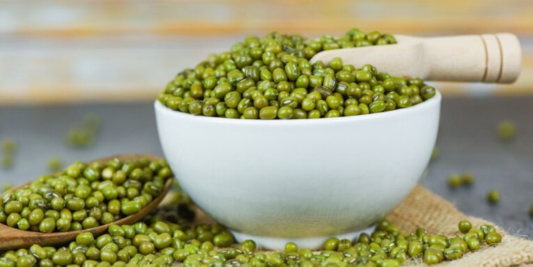Mung beans on bowl agricultural products on the sack / dry green mung beans